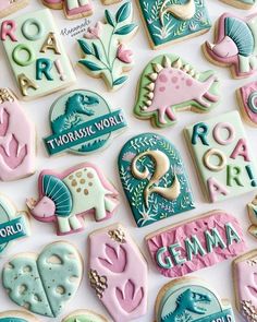 decorated cookies are arranged on a white surface