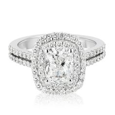 a cushion cut diamond engagement ring with double halos