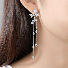 Material: Copper, Rhodium Plated, Cubic ZirconiaSize: 8.6cm by 1.8cmWeight: 6.2gDesign: Crystal Flowers and Leaves on a Chain Drop Dangle Statement Earring Color: White, Silver Silver Prom Jewelry, Formal Jewelry, Crystal Earrings Wedding, Crystal Bridal Earrings, Prom Earrings, Prom Jewelry, Statement Earring, Fancy Jewelry, Dangly Earrings