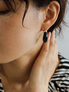 Indulge in the irresistible charm of our Black Onyx Moon Huggie Earrings! Crafted with sleek black onyx stones set in a moon-shaped huggie design, these earrings will add a touch of elegance and mystique to any outfit. Elevate your style and enchant those around you with these stunning earrings. Metal:Metal: 18K Recycled Gold Plated Vermeil on Recycled Sterling Silver/Recycled Sterling Silver Gemstones:Black Onyx Dimensions: length 27mm Weight: 8g each Modern Black Small Hoop Jewelry, Modern Black Hoop Jewelry, Black Hoop Earrings For Everyday, Black Everyday Hoop Earrings, Everyday Black Hoop Earrings, Sleek Single Earring Jewelry For Gift, Minimalist Black Small Hoop Huggie Earrings, Black Sterling Silver Hoop Earrings For Everyday, Black Minimalist Sterling Silver Hoop Earrings