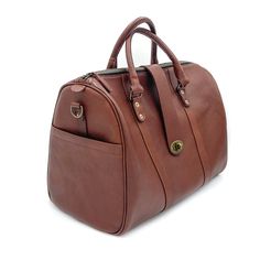 Elevate your carry-on with our newest bag the Travel Duffle. A bag that gets you anywhere you need to go, from the conference room to a weekend retreat, packing everything you need in style. Handcrafted in full-grain leather with antique brass hardware and storage compartments both inside and out. Complete with zipper closure, top strap buckle accent, smooth and sturdy handles, and removable crossbody strap. Details Double top handles Adjustable 54" crossbody strap Zipper and front clasp closure Travel Duffle Bag, Mens Travel, Antique Brass Hardware, Travel Duffle, Duffle Bag Travel, Storage Compartments, Leather Design, Brass Hardware, A Bag