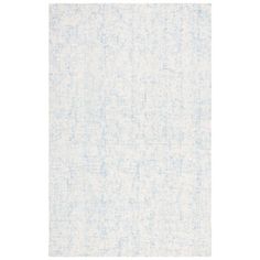 a white and blue rug with small dots on it