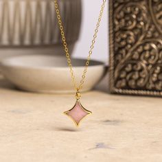 Pink Opal Star Gold Necklace -14k gold filled adjustable dainty chain - Minimalist, cute pink jewelry for daughter, niece, new mom, friend Stone: Genuine Pink Opal Please note due to nature of our genuine stones no two are alike and the ones you will receive will vary slightly from the ones pictured in the photos. Bezel: Vermeil Gold Chain: 14k Gold Filled, 16 to 18 inch adjustable, 1.3mm cable, Spring Ring Clasp Oval Gemstone: 13mm wide x 13mm height About "Gold Filled Jewelry": Also called rolled-gold. These jewelry items are not actually filled with gold. They are made of a base metal covered by sheets of gold in a mechanical bonding process. Effectively a thick coat of gold: the industry standard for the gold content is 5% or 1/20 of the total weight. Made with 14k gold, it is hard wea Hypoallergenic Pink 14k Gold Filled Jewelry, Pink Hypoallergenic Necklace For Mother's Day, Dainty Adjustable Rose Gold Charm Necklace, Dainty Pink Jewelry With Adjustable Chain, Pink Delicate Chain Necklaces As Gift For Her, Pink Necklace With Adjustable Chain For Her, Pink Jewelry With Adjustable Chain For Mother's Day, Dainty Pink Necklace For Her, Pink Dainty Necklace For Mother's Day