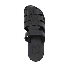 The Michael Pacific Slide is a stylish sandal-inspired footwear in Black full-grain leather, which is perfect for adding flair and comfort to your wardrobe. Premium top-quality leather offers exceptional comfort and durability. The unique leather upper sole molds to your feet for a personalized fit, and the robust polyurethane outsole ensures all-day wear. Enjoy these closed-toe sandals in any environment, from city to beach. Handcrafted in East Jerusalem using 100% natural leather, the Michael Leather Slides With Textured Sole, Leather Slides With Textured Sole And Round Toe, Modern Leather Slides With Round Toe, Leather Slide Sandals With Textured Sole, Leather Slides With Textured Sole And Open Heel, Modern Leather Slides With Textured Sole, Leather Slides With Open Heel And Leather Sole, Leather Slides With Open Heel And Leather Footbed, Casual Leather Slides With Textured Sole