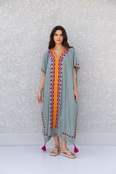 "This beautiful Moroccan butterfly Kaftan has a unique presence to it. It's colorful and most importantly comfortable wear, light and soft and can be used on many occasions - home gatherings, dinners, or just in your home to feel comfortable. Fabric : 80% Egyptian Cotton and 20% Polyester Measurements : Free size. Fits up to 4XL. Also there is a belt that can be used to tighten the dress around the hips. Bust size : 67 inches Length : 57 inches **Note : The kaftan in the video is a different col Bohemian Kaftan With Kimono Sleeves And Floral Embroidery, Long Multicolor Kaftan With Resham Embroidery, Bohemian Embroidered Maxi Length Kaftan, Bohemian Thobe For Beach Eid Celebration, Bohemian Kaftan With Geometric Embroidery For Beach, Bohemian Beach Kaftan With Geometric Embroidery, Bohemian Short Sleeve Kurta For Eid, Bohemian Short Sleeve Thobe For Beach, Geometric Embroidered Kaftan For Vacation