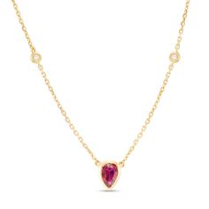 A delightfully modern look, this gemstone station necklace is an effortless addition to her wardrobe. Created in 14K gold, this adorable design showcases a 6.0 x 4.0mm pear-shaped bright red ruby centered beneath a duo of bezel-set round diamond accents stations. Buffed to a brilliant luster, this 18.0-inch rolo chain necklace secures with a spring-ring clasp.  #julybirthstone #wheremyleosat #redruby #genuine #earthgrown #bezelset #yellowgold #gold #July Yellow Gold Ruby Teardrop Necklace, Yellow Gold Teardrop Ruby Necklace, Teardrop Ruby Necklace In Yellow Gold, Jewelry Vendor, What House, Ruby Necklace, Royal Jewels, Bezel Set Diamond, Station Necklace