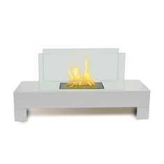 a white table with a glass fire place on top and flames in the bottom section