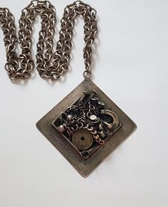 Vintage Brutalist Silver K-J.B. Denmark NecklaceFabulous vintage Brutalist design, a silver plate necklace with unusual and daring Brutalist designBig and chunkyGood condition, does have some ag patinaSigned Design K-J.B. DenmarkThe chain measures about 36" end to end, the pendant measures about 2.25"Very different and fun pieceThanks For Shopping Brutalist Oxidized Metal Jewelry, Brutalist Metal Necklace With Oxidized Finish, Vintage Handmade Metal Chain Necklace, Brutalist Pendant Jewelry Gift, Handmade Vintage Metal Chain Necklace, Vintage Engraved Square Pendant Necklace, Unique Metal Chain Necklace As Gift, Silver Brass Chain Necklace With Large Pendant, Formal Silver Brass Chain Necklace