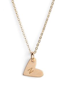 From humble beginnings to a fully staffed warehouse in Oregon, Nashelle remains true to its original purpose-handmade jewelry crafted with love and intention. The heart initial necklace is no different-with a hand-stamped pendant anchored by a single ring, it makes for a perfect layering piece. Style Name:Nashelle 14K-Gold Fill Initial Mini Heart Pendant Necklace. Style Number: 5143637. Available in stores. Everyday Adjustable Heart Pendant Charm Necklace, Simple Personalized Heart Pendant Jewelry, Everyday Initial Heart Pendant Necklace For Mother's Day, Minimalist Heart Charm Jewelry For Anniversary, Minimalist Heart Charm Jewelry For Anniversary Gift, Simple Heart Charm Jewelry For Mother's Day, Simple 14k Gold Jewelry For Valentine's Day, Everyday Personalized Heart Initial Necklace, Simple Personalized Heart-shaped Necklace