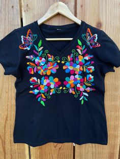 "Beautiful! Hand embroidered t- shirts ! One of a kind embroidered t- shirts ! Comfortable, fresh , one if a kind t- shirts ! Fabric : cotton. Care : hand wash/hang to dry/ low iron / NO BLEACH. MEASUREMENTS: Length: 24.5 Armpit to armpit: 20\"	is_active	20458565	Apparel & Accessories > Clothing > Shirts & Tops	https://www.etsy.com/listing/984295898/size-medium-6us-hand-embroidered-t-shirt	clothing > womens_clothing > tops_and_tees > tshirts > graphic_tees	https://i.ets Multicolor Embroidery Short Sleeve Tops For Festival, Relaxed Fit Multicolor Embroidered Tops, Traditional Cotton T-shirt For Summer, Multicolor Embroidery Short Sleeve Festival Tops, Festival Cotton Tops With Floral Embroidery, Cotton Tops With Floral Embroidery For Festival, Embroidered Cotton Top For Festival, Custom Embroidered Short Sleeve Shirt For Summer, Cotton Floral Embroidered Tops For Festivals