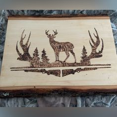 a wooden plaque with an image of a deer on it