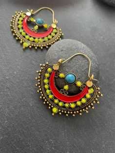 "This Unique pair of Earrings is designed and crafted at PraNiCollectioNs  PraNiCollectioNs is the place for anyone who Is in lookout for a latest trend with an ethnic touch.  We at PraNiCollectioNs offers a great range of Indian Ethnic jewellery's. We are strongly committed to  providing our customers  some uniquely handcrafted products with utmost satisfaction. These jewellery's are made from high quality  material which are Hypoallergenic and are also free from corrosion and rusting This list Bohemian Multicolor Hoop Earrings, Green Bohemian Beaded Hoop Earrings, Bohemian Brass Earrings With Latkans, Bohemian Multicolor Hoop Earrings For Festival, Traditional Multicolor Hoop Earrings For Festivals, Bohemian Metal Earrings With Latkans, Handmade Green Bohemian Plug Earrings, Bohemian Festive Plug Earrings With Latkans, Bohemian Green Small Hoop Earrings