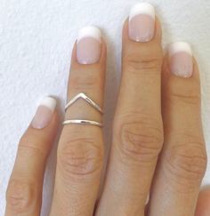 Sterling silver knuckle ring ∙ Stacking rings ∙ Midi rings ∙ Mid finger ring ∙ knuckle ring set ∙ Silver rings For people with misaligned fingers or joints, wearing a lateral deviation ring is advantageous. It offers assistance, aids in deviation correction, and encourages perfect alignment, so easing discomfort and enhancing general hand function and dexterity. A splint ring is a medical accessory made to support and stabilise fingers or joints that have been hurt or have become weak. It is a crucial tool for injury recovery and rehabilitation since it aids in immobilisation, fosters healing, and provides comfort. 🖤 Product Details: Handmade Item Material: 925 Sterling Silver Size: All sizes available. And can be Personalized  Style: Boho  We crafted these ring in pure Silver, and This S Ring Set Silver, Mid Finger, Mid Finger Rings, Knuckle Ring, Knuckle Rings, Ring Stacking, Midi Rings, Finger Rings, Finger Ring