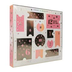 a pink and white box with numbers, stars, and shapes on the inside of it