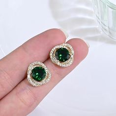 [Beautiful Design] Emerald green earrings adopt circle design, the green gem was surrounded by stunning cubic zironia, full of modern style, gorgeous and fashionable. The CZ add a touch of luxury and exclusivity to the green stud earrings. [High Quality] Emerald stud earrings made of high-polished gem stone and 925 sterling silver. 100% free from BPA, nickel, cadmium, and lead. It is hypoallergenic and preventing from ear infection, you can wear it even your ears are sensitive. This emerald and Green Stud Earrings, Emerald Stud Earrings, Emerald Green Earrings, Green Gem, Emerald Earrings Studs, Gold And Green, Green Gems, Birthstone Earring, Emerald Earrings