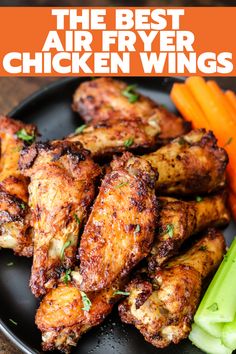 the best air fryer chicken wings on a plate with carrots and celery