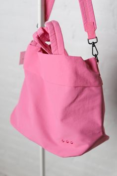 Meet your new BFF - the Carrie Catch All Shoulder Tote Bag! This trendy athleisure bag is perfect for gym days, running errands, or just looking stylish on the go. Comes in multiple colors including black, white, fuchsia, and lilac. Includes a removable strap, inner zipper pocket, and middle divider that also has a zipper pocket for all your essentials. Plus, a latch closure for extra security. Functional Pink Everyday Bags, Pink Large Capacity Casual Gym Bag, Casual Pink Gym Bag With Large Capacity, Functional Pink Gym Bag For Everyday, Trendy Shoulder Gym Bag For Everyday Use, Trendy Everyday Use Gym Shoulder Bag, Pink Nylon Shoulder Bag For Everyday Use, Everyday Pink Nylon Shoulder Bag, Functional Pink Gym Bag