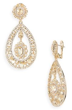 Goldtone filigree teardrop earrings encrusted with pavé crystals evoke opulent glamour. 2 1/2" drop; 1 1/8" width Metal/glass Imported Elegant Teardrop Crystal Embellished Earrings, Teardrop Jewelry With Intricate Design For Party, Teardrop Party Jewelry With Intricate Design, Teardrop Chandelier Earrings With Diamond Accents For Formal Occasions, Formal Teardrop Chandelier Earrings With Diamond Accents, Teardrop Evening Jewelry With Diamond Accents, Dazzling Teardrop Chandelier Earrings For Evening, Evening Teardrop Jewelry With Diamond Accents, Teardrop Jewelry With Diamond Accents For Evening