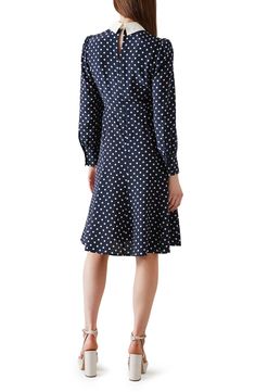 Decorative buttons add a touch of sparkling sophistication to a long-sleeve silk dress featuring bright polka dots and a contrasting point collar. Hidden back-zip closure Point collar Long sleeves with button cuffs 100% silk Dry clean Imported This brand is certified with the Butterfly Mark, which identifies luxury brands that adhere to social and environmental best practices
 This brand meets Nordstrom Responsible Brands criteria: brand adheres to responsible social and environmental practices Fitted Polka Dot Dress For Daywear, Silk Polka Dot Spring Dress, Spring Silk Polka Dot Dress, Silk Polka Dot Dress For Spring, Polka Dot Midi Length Workwear Dresses, Polka Dot Midi Length Dresses For Work, Polka Dot Midi Dress For Work, Fitted Silk Polka Dot Dress, Elegant Silk Polka Dot Dress