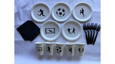 a table topped with plates and cups filled with different types of sports related items on it