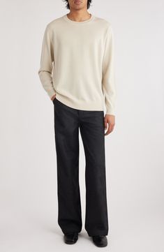 Casual and versatile, this sweater knit from soft, breathable wool features a relaxed fit that's easy to layer and always comfortable on its own. Crewneck Long sleeves Ribbed cuffs and hem 100% merino wool Dry clean or hand wash, dry flat Imported Designer Clothing Beige Merino Wool Sweater With Ribbed Collar, Neutral Long Sleeve Cashmere Sweater, Casual Neutral Turtleneck Sweater, Classic Cashmere Sweater In Neutral Color, Beige Relaxed Fit Cashmere Sweater, Classic Knit Sweater For Loungewear, Relaxed Fit Turtleneck Sweater, Beige Relaxed Fit Sweater For Work, Neutral Wool Sweater With Long Sleeves