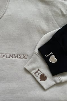 a close up of a white shirt with the word mmmm on it