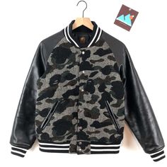 Rare- Hard To Find -New-Never Worn In Original Bag- Mr Bathing Ape 1st Camo Tweed Varsity Jacket Size M Very Fitted, Really Fits Like A Male Small It Features A Body Made From Wool Tweed, Leather Sleeves And Athletic Ribbed Cuffs And Waistband. This Joint Look Sick Originally Featured At A Price Tag Of Over $1000 & Immediately Sold Out!! Https://Www.Sugarcayne.Com/2014/09/Mr-Bathing-Ape-Tweed-Camo-Varsity-Jack/#Google_vignette Bape Jacket, Bape Men, Bape Hoodie, Souvenir Jacket, A Bathing Ape, Baseball Jacket, Leather Sleeve, Fall Jackets, Mens Spring