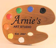 an artist's palette with the name annie's art studio on it