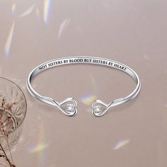 If you're looking for a beautiful and sentimental way to show your best friend some love, this bracelet is a perfect choice. The sleek, minimalist design is perfect for everyday wear, and the two delicate hearts represent you and your best friend, reminding you of all the good times you shared together. Whether you wear it as a daily reminder of your special bond or give it to your best friend as a gift, this bracelet is sure to be cherished for years to come. Why buy from us?: Crafted in Solid Silver Heart Bracelet For Best Friend On Valentine's Day, Minimalist Bangle Jewelry For Valentine's Day, Minimalist Heart Bangle Bracelet As Gift, Elegant Stainless Steel Heart Bangle Bracelet, Silver Heart Bracelets For Best Friend Gift, Elegant Adjustable Heart Bracelet For Best Friend, Inspirational Bracelet Jewelry For Mother's Day, Heart-shaped Silver Bracelets For Best Friend Gift, Minimalist Sterling Silver Heart Bracelet For Mother's Day