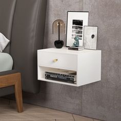 PRICES MAY VARY. 【Space Saving Design Nightstand】The RANK Floating Bedroom Modern 1-Drawer Nightstand with Open Shelf, White is the ideal companion for your modern bedroom.The hanging design gives you the flexibility to place it at any height and saves valuable floor space. 【Large Storage Capacity】 The nightstands with both a drawer and an open compartment, it holds all your typical bedside essentials like books, magazines and glasses.Overall Dimension: 15.8” L x 11.8” W x 9.8” H ;Drawer Size: 1 Hanging Side Table, Shelf With Drawer, White Nightstands, Nightstand Modern, Storage For Living Room, Floating Bedside Table, Rustic Wood Floating Shelves, Wall Mounted Shelf, Bedside Shelf