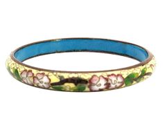 "This is from my personal collection. I received this beautiful bracelet from my mother in 1978 as a young stylish and headstrong woman of the 1970s. I wore it with pride for many years. It is a gold wire on enamel the cloisonne is a beautiful floral detail. They are genuine and come with my personal provenance. These are authentic 1978 Bohemian styles. They were purchased likely from Emporium Capwell in Fremont, CA. Fashion enamel jewelry decorated with gorgeous brightly colored flowers and pat Retro Handmade Bangle Jewelry, Antique Blue Bracelet As Gift, Vintage Multicolor Bracelets For Formal Occasions, Handmade Retro Bangle Bracelet, Vintage Jubilee Bracelet Gift, Retro Bracelet Jewelry As Gift, Vintage Blue Bangle Bracelets, Vintage Multicolor Bracelets, Antique Bangle Bracelets As Gifts