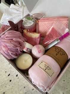 a pink box filled with lots of different types of soaps and other personal care items