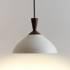 a white and brown light hanging from a ceiling