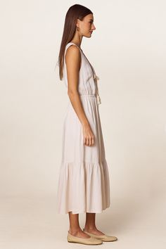 The embodiment of carefree summer spirit. Wear this breathable, versatile dress for a day on the beach, a stroll through the farmers market, or your neighbor's sunset garden party. Spring Summer Flowy Maxi Dress, Flowy Spring Maxi Dress For Summer, Flowy Maxi Dress For Spring, Beachy Sundress For Spring Beach Cover-up, Breezy Sleeveless Linen Dress For Spring, Midi Length Boho Dress For Summer Garden Party, Beachy Sleeveless Midi Dress As Beach Cover-up, Breezy V-neck Beach Dress For Summer Outings, Vacation Maxi Dress For Garden Party