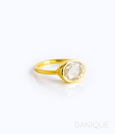 "You'll fall in love with the stunning clarity and reflective quality of this crystal Clear Quartz ring. This is a perfectly sized oval to compliment any collection. Popular as a birthday gift for those April babes and Quartz lovers alike. This is a completely transparent stone with no flaws. Clear Quartz is a common alternative to diamond. This stone is beautifully faceted and bezel set in a 925 sterling silver band or plated with 18k vermeil gold. Gemstone is approximately 8 x 12mm. Band has 9 Oval Crystal Ring With Rose Cut Diamonds For Anniversary, Oval Birthstone Ring With Rose Cut Diamonds For Promise, Promise Oval Birthstone Ring With Rose Cut Diamonds, Oval Faceted Rings In Fine Jewelry Style, Elegant Oval Diamond Cut Birthstone Ring, Elegant Oval Birthstone Ring With Diamond Cut, Oval Gold Faceted Rings, Oval Faceted Rings For Anniversary, Gold Oval Faceted Ring