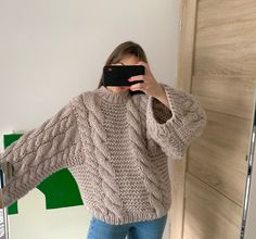 "Beige chunky knit pullover HANDMADE READY TO SHIP Yarn 65%alpaca/35%wool Size on the photo: ONE SIZE ✔️ Lenght - 57 cm/22\" ✔️ Width - 55 cm/21\" ✔️Sleeve girth - 52 cm/20\" ✔️ Sleeve length - 64 cm./25\"(from the neckline) This is women's hand knit sweater. Handmade  sweater from hight quality wool yarn. This yarn is soft and tender so this sweater is warm and soft. This sweater is delicate work of hand knitting. Sweater has wide sleeves and knitted cables on the back and forward part of pullover. Sleeves also has cable knit pattern. Care Recommend profession clean Or Hand delicate wash 30Co/86Fo Don't hang Don't bleach 🔻Please note that the colour may slightly vary due to photographic lighting sources or your monitor settings." Oversize Cable Knit Sweater, Hand Knitted Sweaters For Women Handmade, Fall Chunky Knit Alpaca Knitting Pattern, Chunky Knit Alpaca Knitting Pattern For Fall, Handmade Merino Wool Sweater For Winter, Oversized Alpaca Chunky Knit Sweater, Oversized Chunky Knit Alpaca Sweater, Handmade Merino Wool Winter Sweater, Handmade Beige Winter Sweater