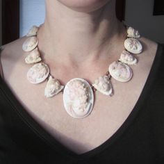 "Let me tell you something, you don't see a Victorian necklace like THIS every day! This exquisite necklace was made circa 1870 and features EIGHTEEN hand carved queen conch shell cameos of graduating size with alternating bacchante and cherub motifs, backed by 14k gold. Most likely a souvenir from the Grand Tour, this is as Victorian as it gets! Absolutely ethereal when worn and would make the most amazing, AMAZING necklace for a bride! Measures 18\" length. The largest cameo measures 2 x 1 5/8 Antique Cameo Necklace, Carved Seashells, Antique Gold Cameo Necklace, Ornate Cameo Necklace For Gift, Ornate Oval Cameo Necklace, Antique Cameo Jewelry, Intaglio Jewelry, Antique Necklace Victorian, Queen Conch Shell