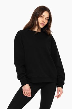 Indulge in laid-back luxury with our Unisex Crewneck in Onyx. Featuring drop shoulders, an oversized fit, and a timeless crew neckline, it's perfect for lounging or casual outings. Embroidered with the SET logo on the upper left chest, it adds a stylish flair to your wardrobe. Boxy Crew Neck Sweatshirt For Everyday, Boxy Fit Crew Neck Sweatshirt For Everyday, Oversized Sweater With Ribbed Crew Neck, Boxy Fit Crew Neck Sweater With Ribbed Neckline, Everyday Boxy Fit Crew Neck Sweatshirt, Basic Oversized Crew Neck Sweats, Oversized Crew Neck Sweater, Oversized Crew Neck Basic Sweater, Oversized Crew Neck Sweater With Ribbed Cuffs