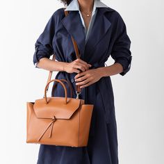 Are you ready to be that stylish woman who walks into the office with one leather tote that does it all? The Loren Tote is the ultimate everyday work bag because it’s made with our signature lightweight Italian leather that holds its shape over time, doesn’t scratch and is easy to clean. Plus, it’s spacious, stylish and so lightweight, that it won’t break your back. Elegant Cognac Shoulder Bag For Workwear, Timeless Cognac Satchel For Travel, Timeless Shoulder Bag For Travel In Fall, Modern Cognac Satchel For Office, Elegant Cognac Shoulder Bag For Travel, Elegant Business Bag In Cognac, Elegant Cognac Satchel For Office, Timeless Top Handle Bag For Fall, Elegant Cognac Bag For Business