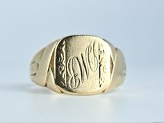 Smart antique signet ring in solid 9K yellow gold from the Art Deco era. This gold signet is a ring size 9 1/2 and has a lovely antique patina. There is a large engravable area which, if desired, can be smoothed over and reengraved. A sturdy ring at 5.13 grams. Marked with original antique marks. Ring size 9 1/2 and easily sized up or down several sizes.  Please allow two weeks for sizing. One month layaway payment plans on items $500 and over available. Approximate Age - Art Deco Gemstone(s) - Rectangular 14k Stamped Signet Ring Collectible, Classic Yellow Gold Signet Ring With Maker's Mark, Engraved Yellow Gold Signet Ring For Formal Occasions, Formal Engraved Yellow Gold Signet Ring, Antique Engraved 14k Gold Ring For Formal Occasions, Formal Yellow Gold Signet Ring With Engraving Option, Gold Round Signet Ring With Maker's Mark, Gold Signet Ring With Maker's Mark, Vintage Yellow Gold Signet Ring With Hallmarks