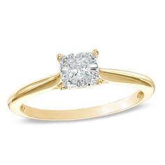 a yellow gold engagement ring with a cushion cut diamond