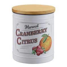 a white canister with a wooden lid that says harvest cranberry citruss