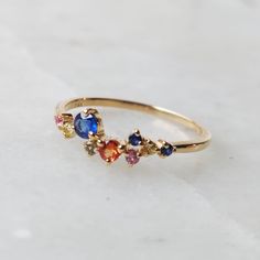 **KINDLY CHECK OUT THE VIDEO OF THE ITEM FOR A CLEARER VIEW** Details of the ring: Gem: Multi Sapphire Gem shape and size: --ROUND- 3.00 MM-1 PC --ROUND- 2.50 MM-1 PC --ROUND- 1.50 MM-7 PC Gem weight: 0.35 carats Gold purity: 14K (58.33% approx.) Gold weight: 1.30 gms Total weight of ring: 1.37 gms Natural Multi Sapphire ring set in solid 14K yellow gold. The Gold purity is guaranteed and it comes with authentic 14 kt gold hallmark. Since these Rings are handmade, Size Customization is available 14k Gold Cluster Ring With Gemstone Accents As Gift, 14k Gold Multi-stone Sapphire Promise Ring, Fine Jewelry Cluster Ring With Multi-stones For Gifts, Fine Jewelry Multi-stone Cluster Ring Gift, Sapphire Multi-stone Cluster Ring Gift, Sapphire Multi-stone Cluster Ring As A Gift, Multi-stone Cluster Birthstone Ring Gift, Cluster Multi-stone Birthstone Ring As Gift, Unique Multi-stone Sapphire Promise Ring