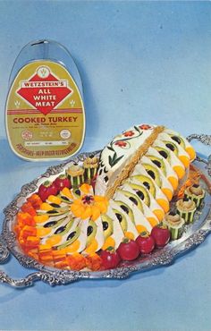 a platter filled with sliced fruit on top of a table