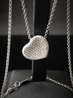 "A special gift for your sweetheart  This floating heart pendant necklace exudes grace and elegance. Crafted in a luxurious 18K white gold, this is a piece to wear and treasure every day. ITEM INFORMATION : 18k white gold The necklace is 42cm (16.5 inches).  Pendant  + Necklace Weight - 9 g Stone - Natural white diamond (118 stones) Weight - 1.18 ct  Cut - Round brilliant cut diamond Setting - micro pave fishtail Clarity - VS-VVS Color - D/E/F COLLECTION 18k solid white gold, Slide heart pendant Heart Shaped Diamond Necklace, Diamond Heart Necklace, Pave Necklace, Heart Necklace Diamond, Puffed Heart, Heart Shaped Diamond, Diamond Pendant Necklace, Diamond Fashion, Diamond Heart