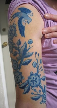 a woman with a tattoo on her arm