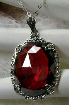 "Red Garnet Cubic Zirconia (CZ) Pendant Bubble Design#P10 Custom Made Inspired by Victorian era designs, this lovely Antique reproduction is lovingly hand-crafted in sterling silver. The flawless 22 carat faceted red garnet CZ is 24mm x 18mm. The entire pendant is 1.5\" long and 7/8\" wide. The chain (if chosen) is adjustable between 18-20\". The necklace is marked 925 for sterling silver. Notice the beautiful craftsmanship of the vintage filigree setting. This pendant necklace is a fantastic re Red Gothic Necklace For Formal Occasions, Red Victorian Necklace For Anniversary, Red Filigree Jewelry For Formal Occasions, Formal Red Filigree Jewelry, Red Ruby Victorian Necklace, Red Pendant Jewelry For Formal Occasions, Red Victorian Jewelry For Anniversary, Red Filigree Jewelry For Anniversary, Ornate Red Wedding Necklaces