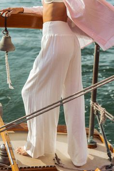 Elevated and breezy, these wide leg palazzo pants take beach chic to a whole new level. The Piscina Linen Pants can be styled as the perfect neutral base to a warm-weather outfit or as a beachside cover up. Featuring an ultra soft linen blend fabric, these flowy extra wide leg pants have a figure flattering smocked high waist, pockets and are fully lined. Product Details Material: 70% Rayon, 30% Linen. Lining: 100% Rayon.Fit: True to size. Length: 29" Inseam; 13" Rise (size Small). Fabric: Soft, Extra Wide Leg Pants, Wide Leg Palazzo Pants, Linen Jumpsuit, Arm Cuff, Beach Chic, Warm Weather Outfits, Ruffle Mini Dress, Sweet Floral, Palazzo Pants