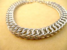 Chainmaille bracelet. Length 19 to 21 cm adjustable.  Chainmaille is an ancient techique, created by the Celts and used for the armours of the knights. Nowadays it is used to make jewelry.  It is made of solid aluminum rings. The weave is called Half Persian 4 in  1 aka Snake. The rings will no tarnish or fade. All you need to clean it is soap and water. This bracelet is the perfect anniversary gift for men or for women. Women Money, Chainmaille Bracelet, Anniversary Gift For Him, Mens Anniversary Gifts, Anniversary Gifts For Him, Wrapped Jewelry, Anniversary Gift For Her, 4 In 1, Wire Wrapped Jewelry