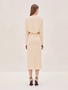 Introducing the Fraser Midi Dress: with a deep V-neckline, flattering draping at the waist, and long sleeves for a sculpted yet refined silhouette that flows gracefully into a sleek midi length. Styled with our Macchi Belt, sold separately. Model wears XS Dress Cream, Skirt Jumpsuit, Cream Dress, Sale Design, Jacket Tops, Midi Length, Blazer Jacket, Jumpsuit Romper, Ready To Wear